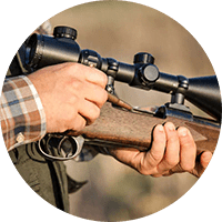 Firearms Safety Course. Close-up of a man holding a rifle.