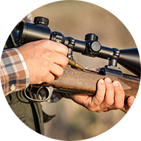 Firearms Safety Course. Close-up of a man holding a rifle.